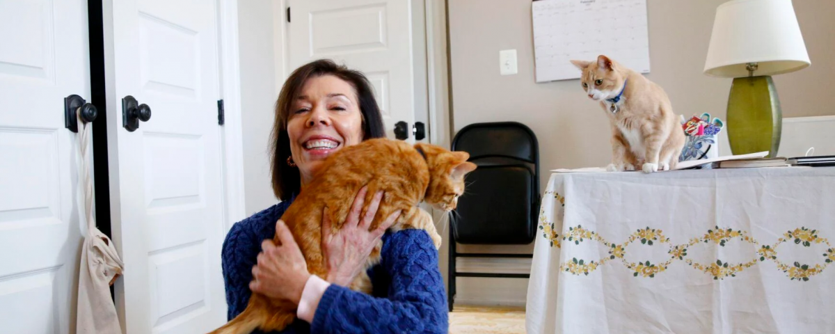 Susan Micari is shown with her cats, Rubilee and Loki, at her home in Richmond on Monday. Last fall, as a volunteer and via Zoom, Micari taught English, primarily to Afghan girls living in a safe house in Kabul.